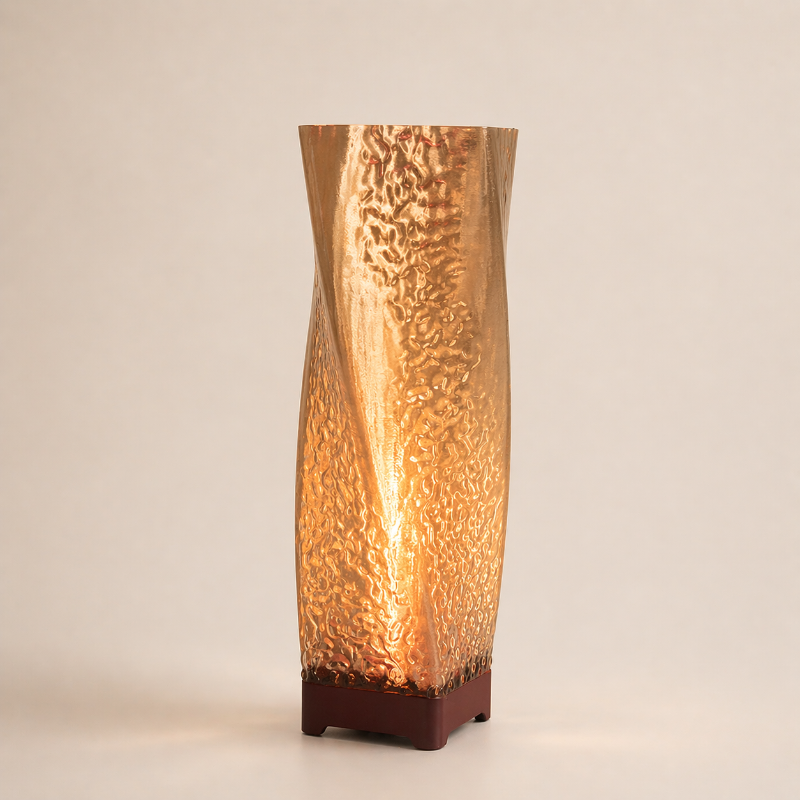 Decorative lamp with textured glass shade on a beige background