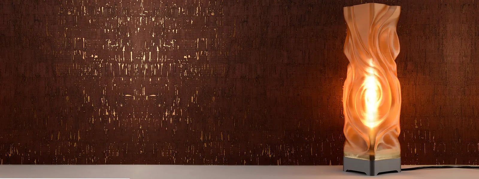 Decorative lamp with a warm glow on a textured brown background
