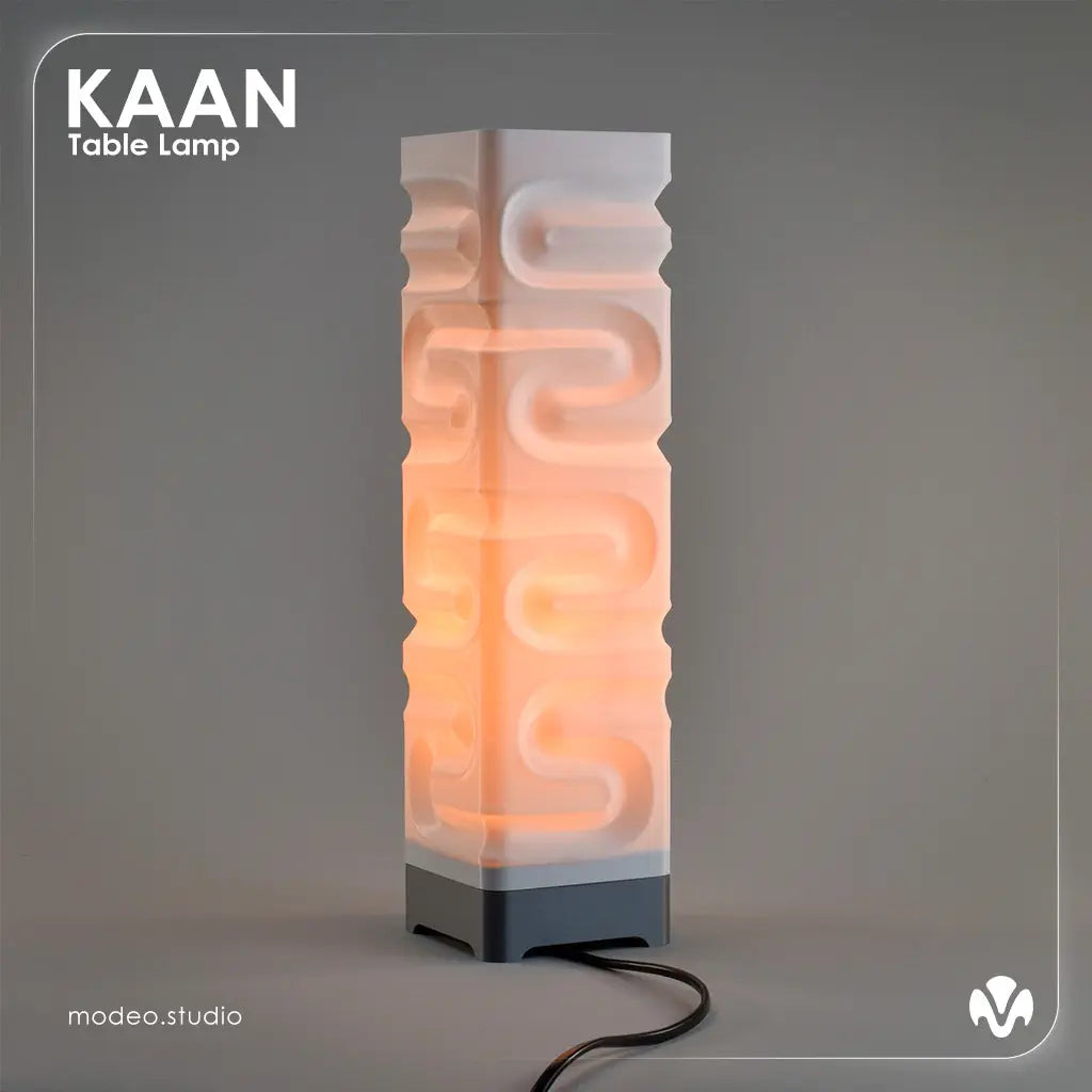 White matte textured table lamp with 'KAAN' branding on a gray background with the light turned on. Created by MODEO Design