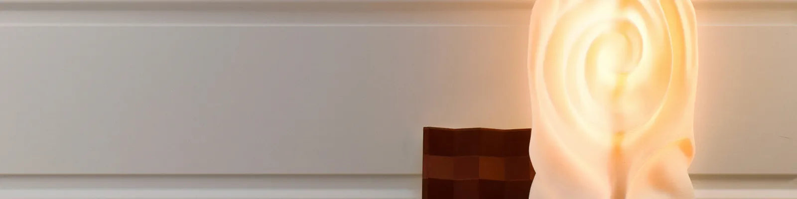 Decorative lamp with spiral design on a white background